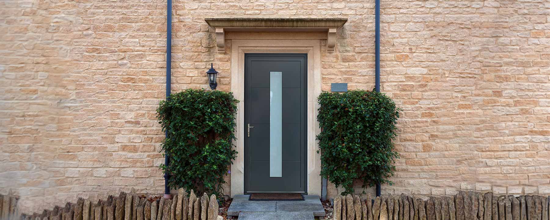 grey modern aluminium front door with glass in the centre